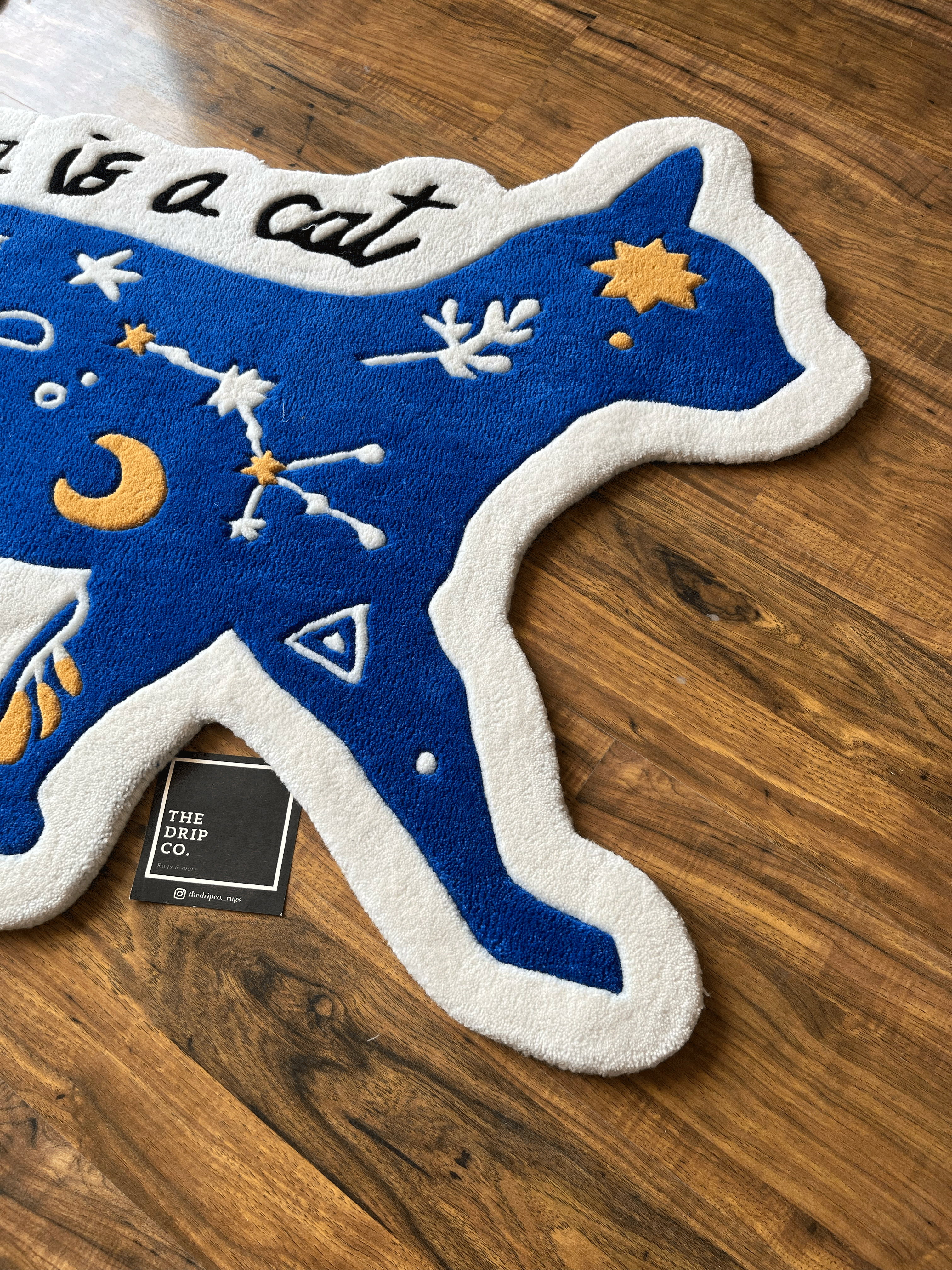 karma is a Cat hand tufted rug by The Drip Co.